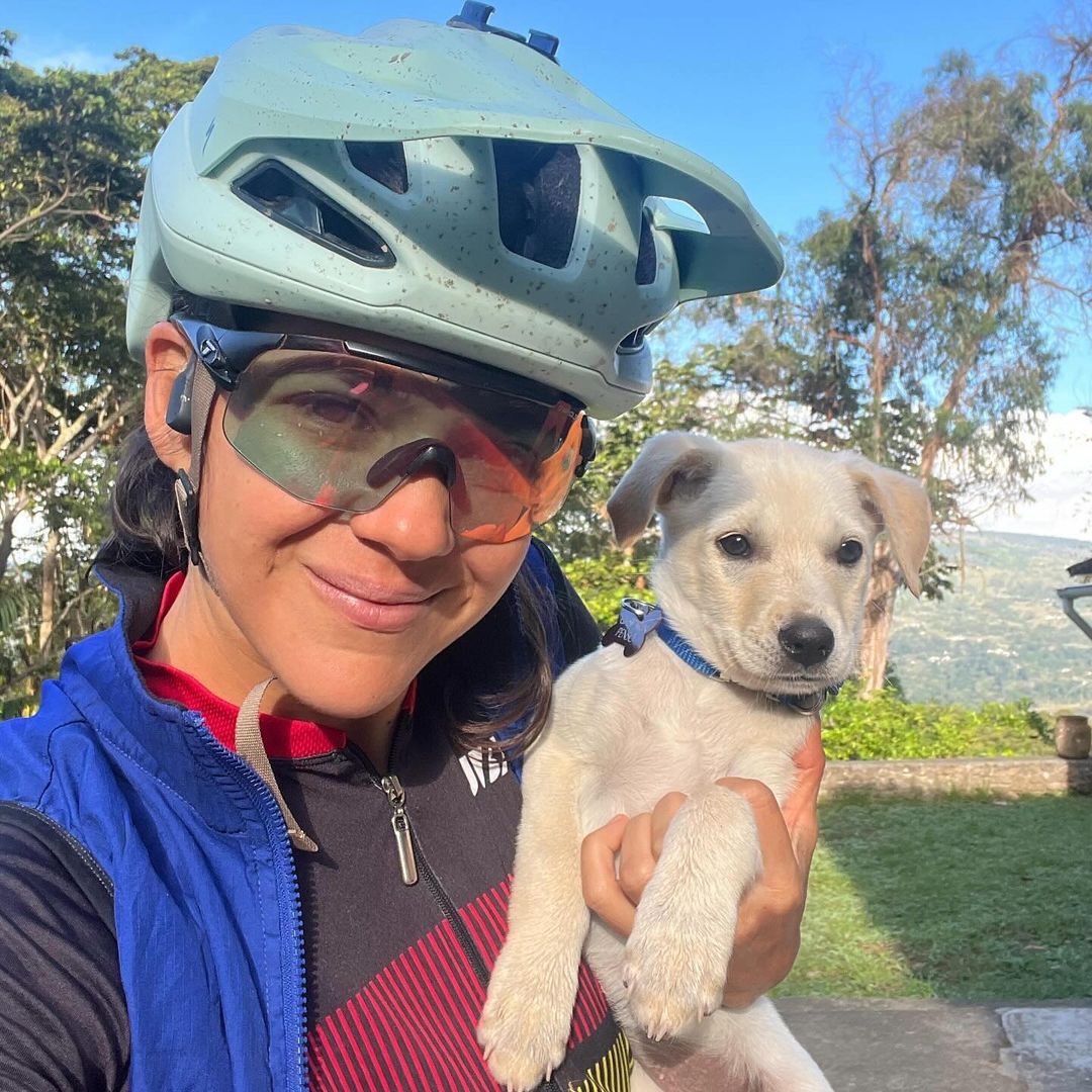 biker holding a puppy