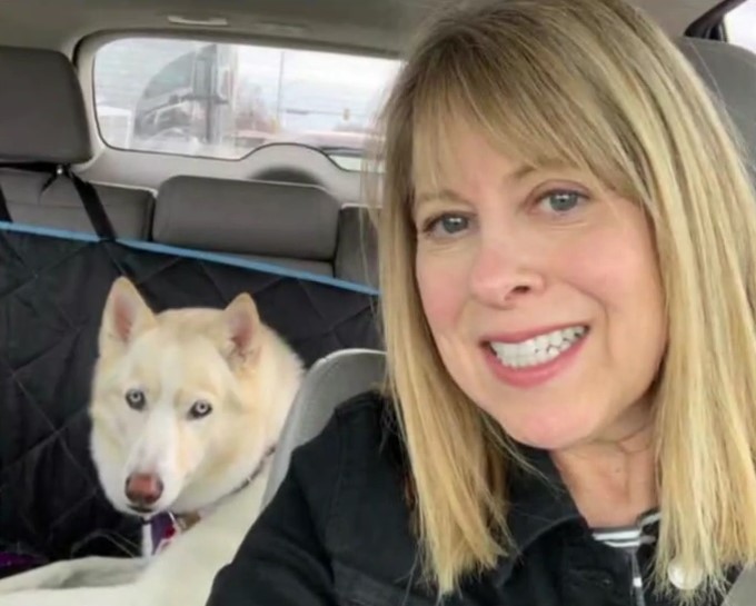 blonde woman and white dog