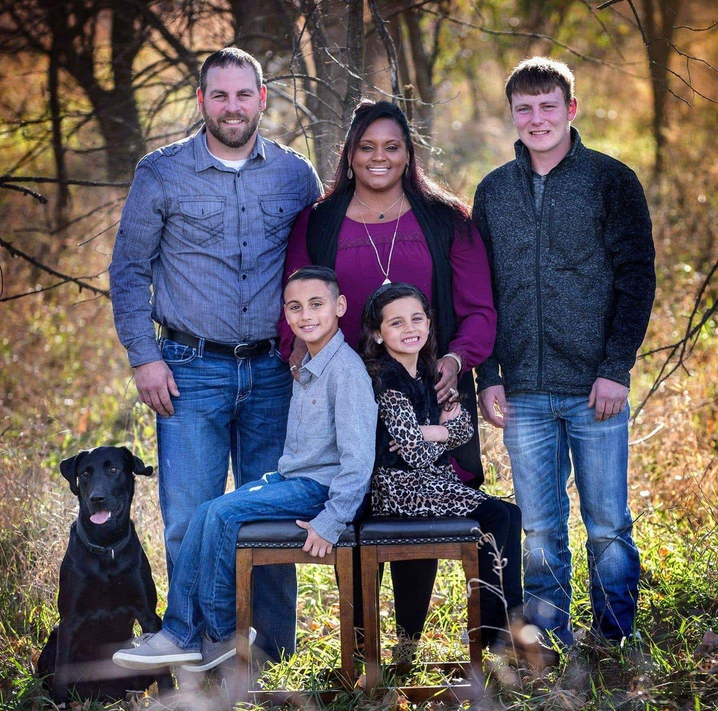 photo of a dog with his family