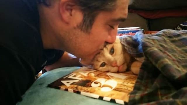 Tigger's dad, Michael Trentadue, gives him a kiss.