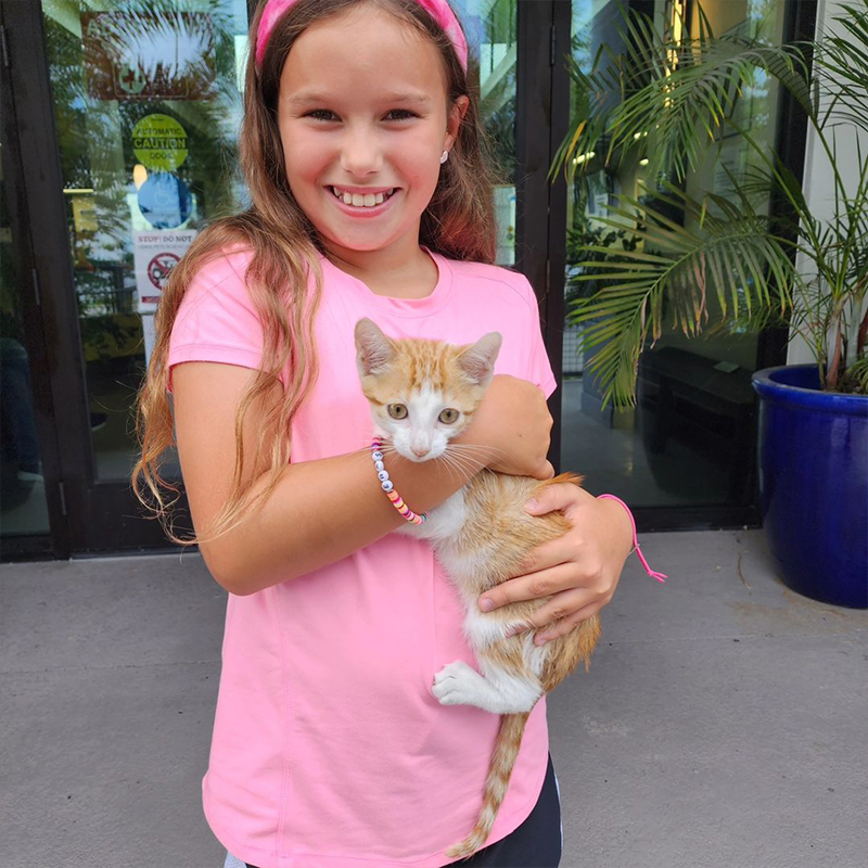 Ryan holds the adopted kitten, 2