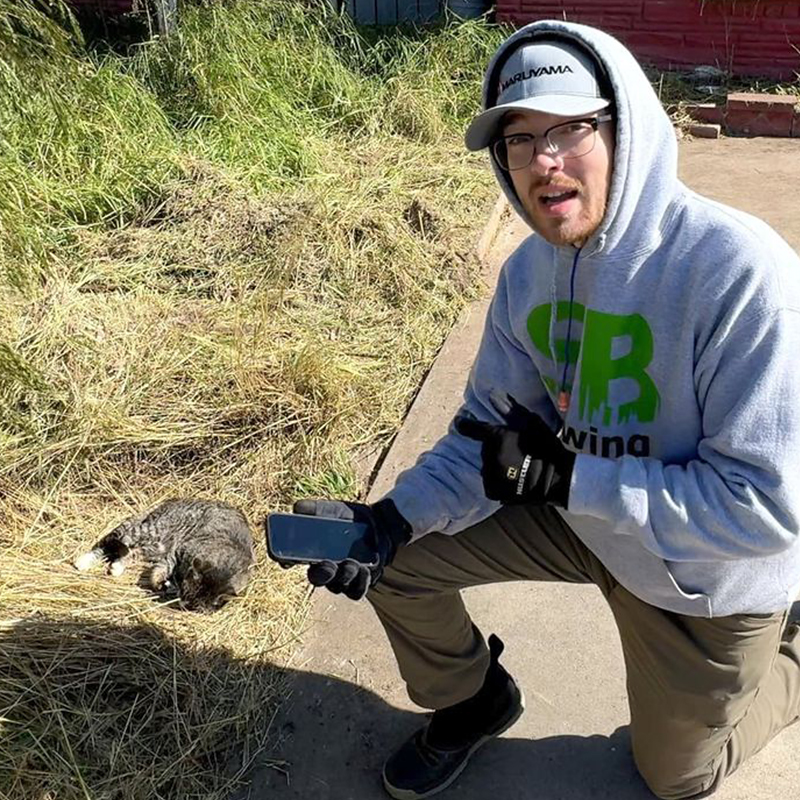 Spencer, Corpus Christi, Texas, Anissa Beal, Edgard and Ivy's Cat Sanctuary, SB Mowing, Kansas, Wichita, lawn mower, man mowing lawns for free, cat saved by man mowing lawns from Kansas, Spencer showing the cat to his followers