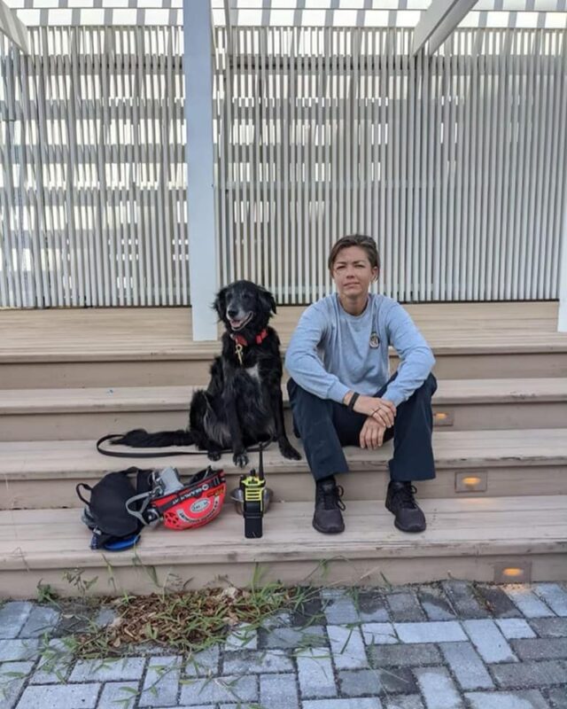 Firefighter with search and rescue dog