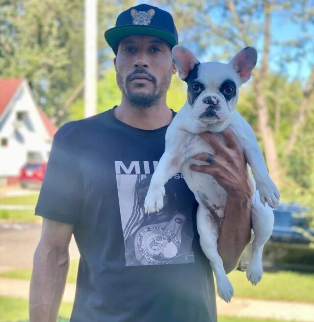 Gary Majors holding French Bulldog