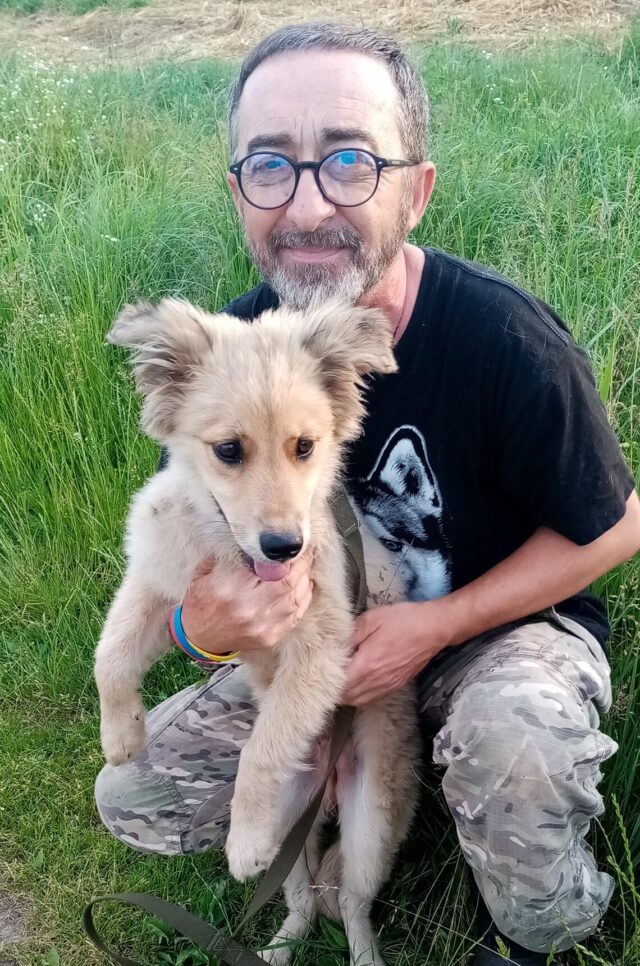 Man in Ukraine holding dog