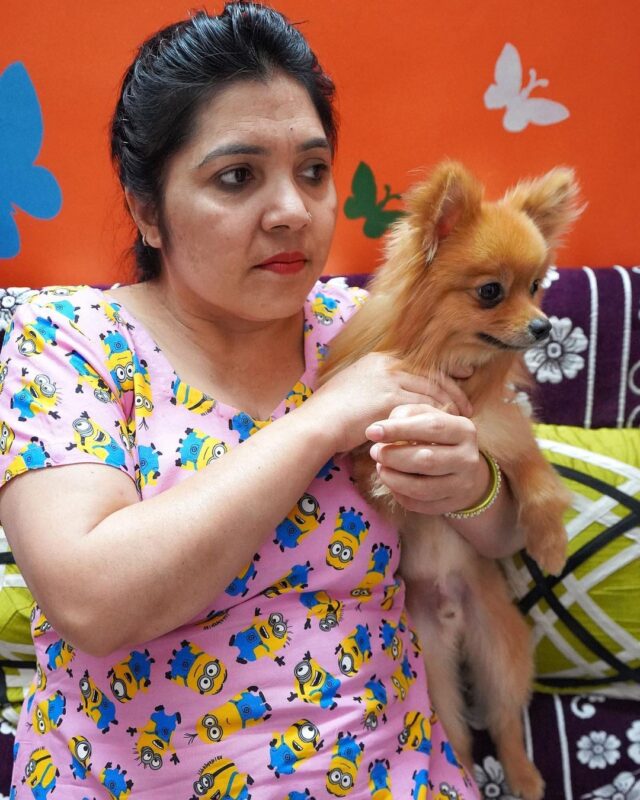 Mother holding Pomeranian