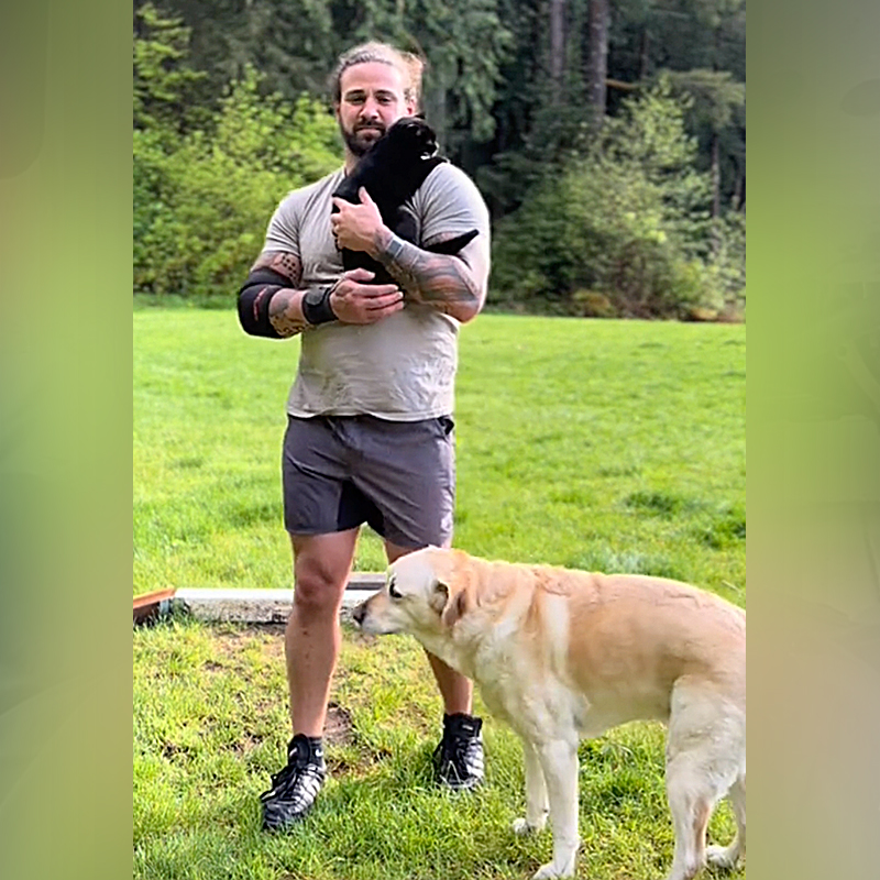 Nathan L. Western Washington, Punkin the black cat, Riley the Yellow Labrador Retriever, cat interrupts Dad's workouts and training, weight toss, hammer toss, Backwoods Highlander, Punkin and Riley the Yellow Lab