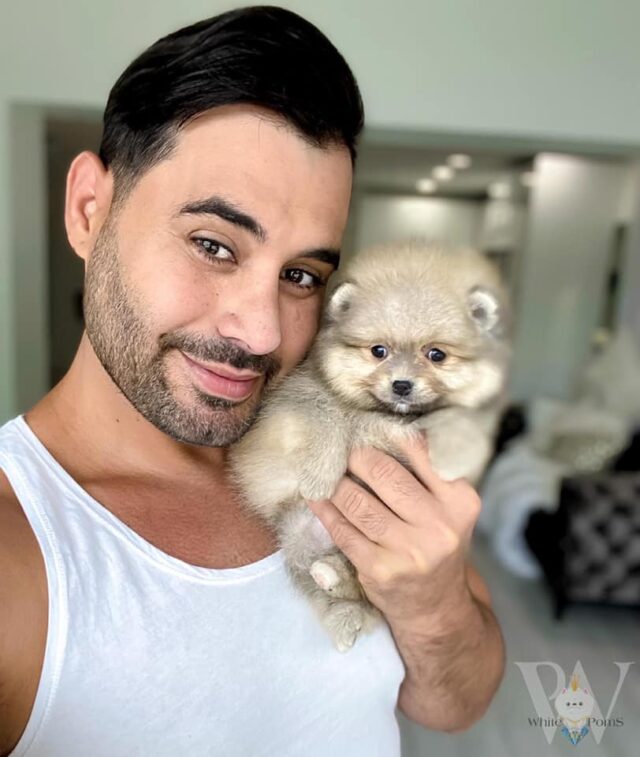 Singer and pomeranian puppy