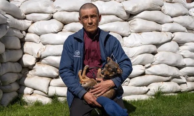 Ukraine man holding his dog