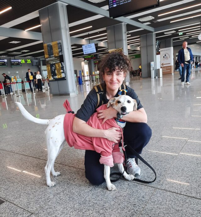 Ukrainian woman hugging dog