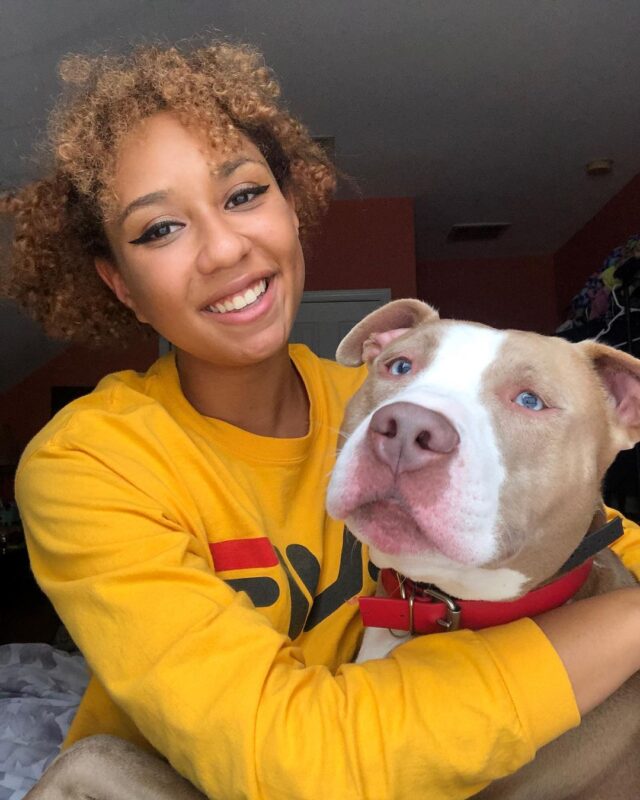 Woman hugging Pit Bull