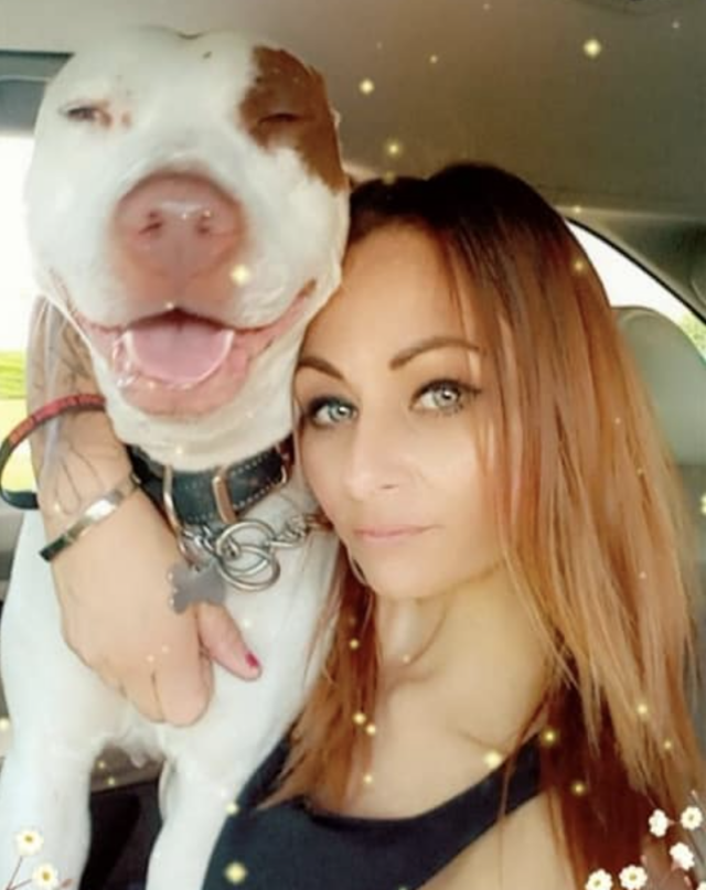 Woman hugging Pit Bull