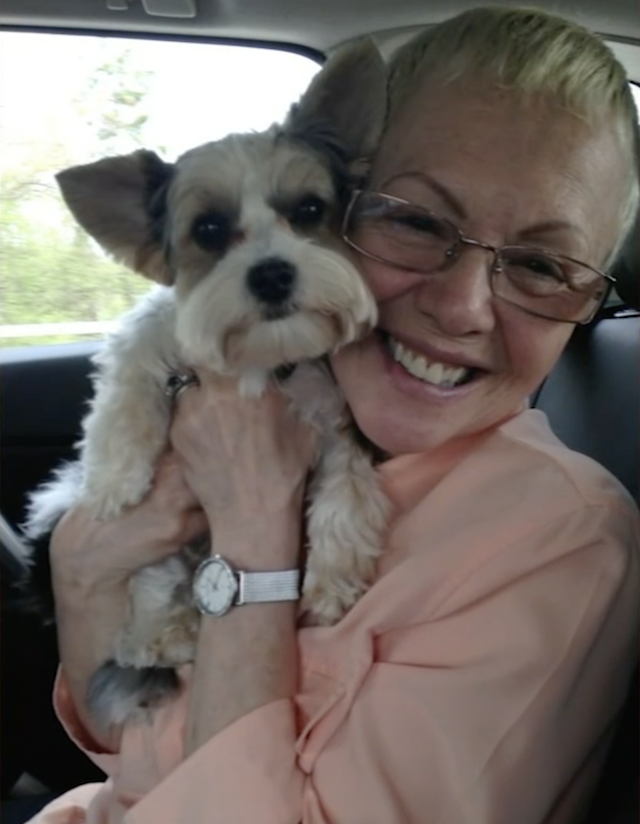 Woman hugging puppy