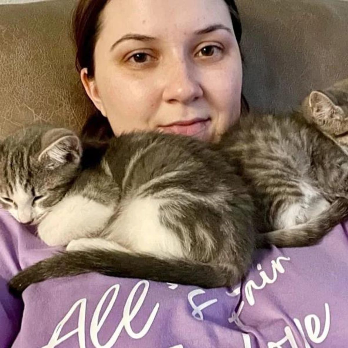 woman and two gray cats